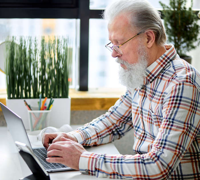 man on computer doing research about Medicare Part D