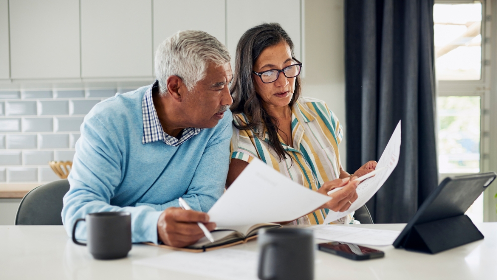 senior-couple-reviewing-medicare-documents Medicare plan comparison insights in Tampa for 2025 enrollment from Medicare Information Project